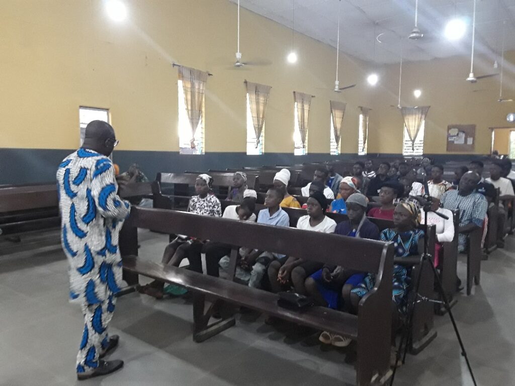 Rev. Dr. John Owoeye ministering to the youths at the Odo Ponyan Outreach